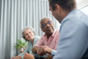 advisor talking to elderly couple