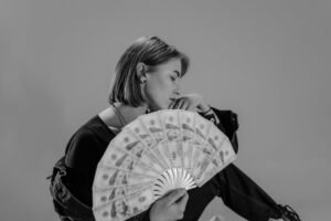 woman holding fan