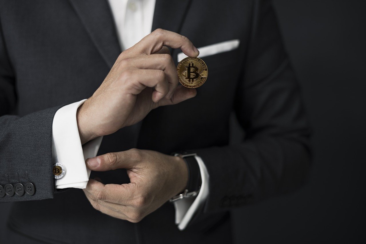 Banking trends man holding bitcoin for decentral publishing