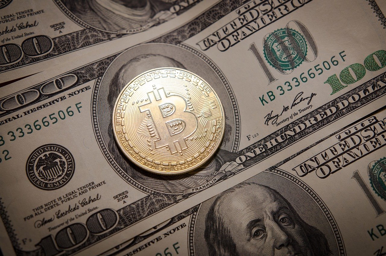 Crypto banking bitcoin on hundred dollar bill for decentral publishing