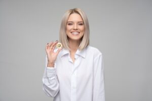 Cryptocurrency investment by generation woman holding a bitcoin coin for decentral publishing