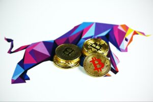 crypto news headlines gold crypto coins with a colorful bull on the background for decentral publishing