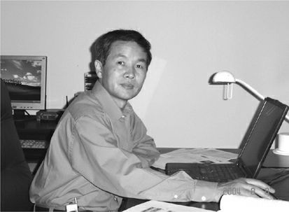 founding fathers of blockchain industry wei dai in front of laptop