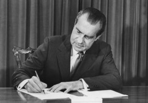 inflation in the US presiden richard nixon signing a document for decentral publishing