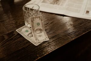 money cartel money on table next to empty glass decentral publishing