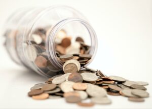 money-falling-out-of-jar-for-savings