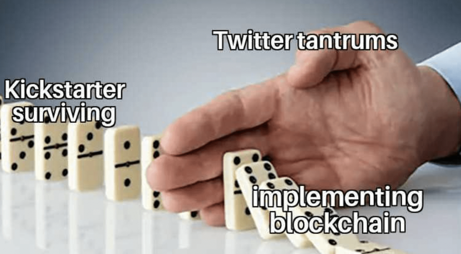 weekly crypto news row of dominos with twitter tantrums blocking the falling implementing blockchain from the kickstarter surviving for decentral publishing meme by Emily Em Weber